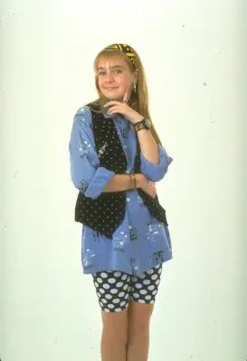 Work with unexpected porportions, like with an oversized button-up and biking shorts.