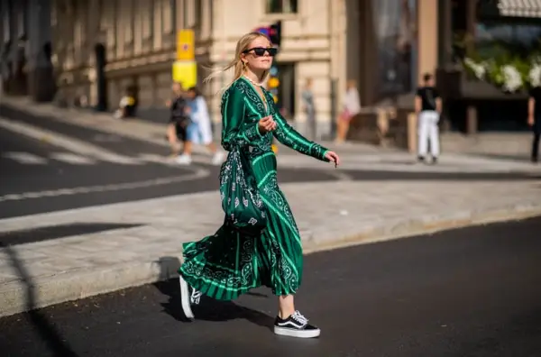 With a Bright Pleated Dress and Matching Bag