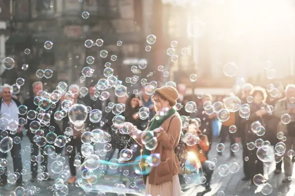 Blow bubbles.