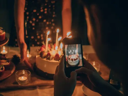 Teenager friends celebrate a birthday party in the dining room at house.