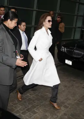 Wear Your Dress Coat Over Trousers to Appear Ladylike, Yet Tough