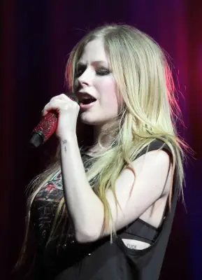 Avril Lavigne’s FUCK Ribcage Tattoo