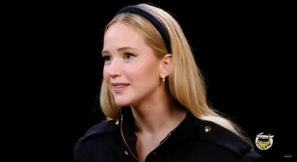 Jennifer Lawrence Wears a Black Headband For Hot Ones Interview