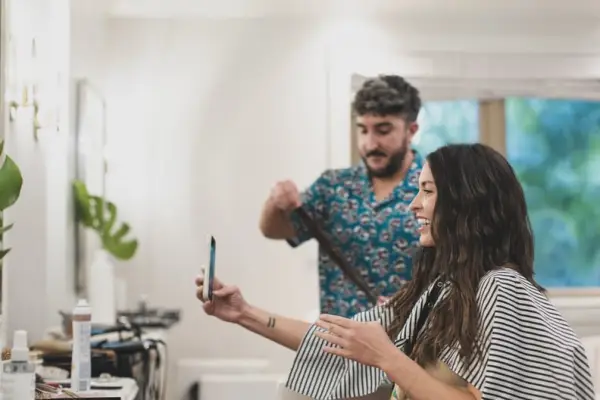 Adding the finishing touches to the Olivia Rodrigo hairstyle
