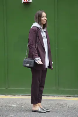 College-Sweatshirt Outfit: Work It Under Your Pantsuit With Flat Loafers