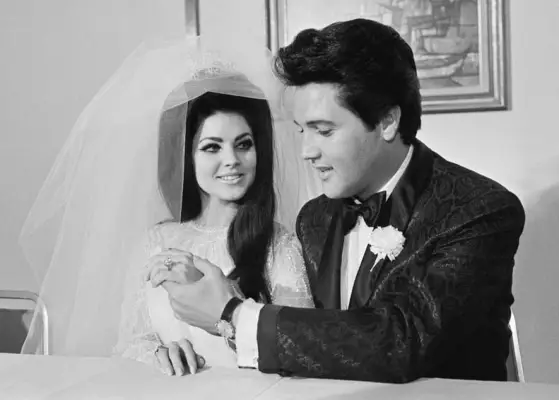 Elvis Presley shows off his wife Princilla
