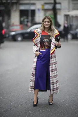 Peeking Out Under a Long Checked Coat