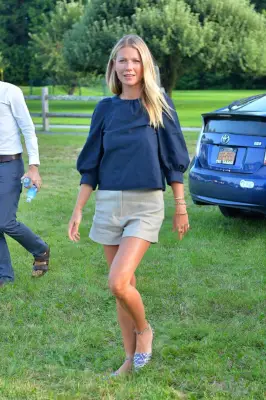 Gwyneth Paltrow Wearing a Black Blouse and Shorts
