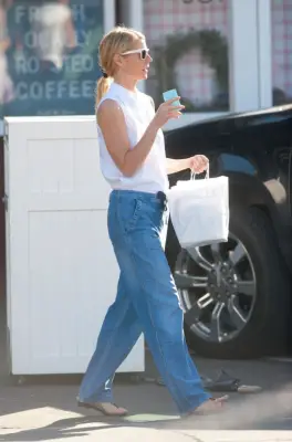 Gwyneth Paltrow Wearing a White Top and Loose Jeans
