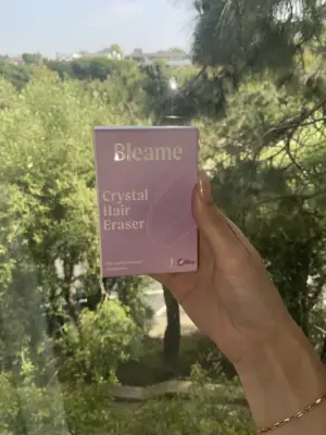 Taylor Holding the Bleame Crystal Hair Eraser