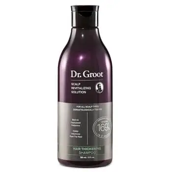 Author with hair in a loose topknot with postpartum baby bangs