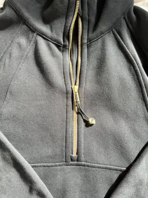 The elastic zipper pull of the Lululemon Scuba Oversized Half-Zip Hoodie.