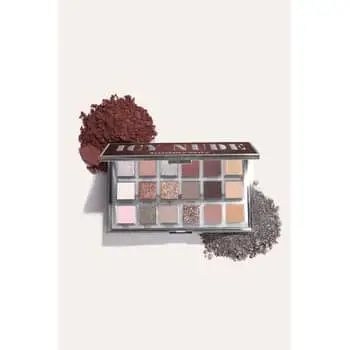 The Huda Beauty Icy Nude Collection, including the Icy Nude Eyeshadow Palette, the Blush Filter Liquid Blush shades in Coco Loco and Latte, and the Faux Filler Lip Gloss shades in She Glitzy, She Flirty, and She Fire.