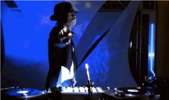 Usher just dancing by himself in the DJ booth.