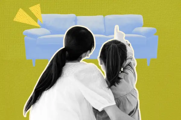 Designed Image of Mother and Daughter Pointing at Blue Couch on Ground In Living Room