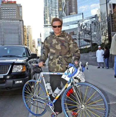 Exhibit H: Robin William in Camo Print with a Bike