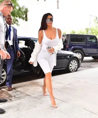 Kim Wearing White Bermuda Shorts in NYC