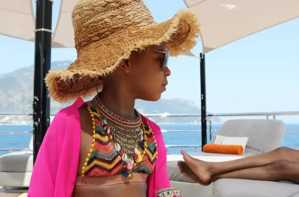 Blue Paired Her Zigzagged Bikini With a Statement Necklace and Straw Hat