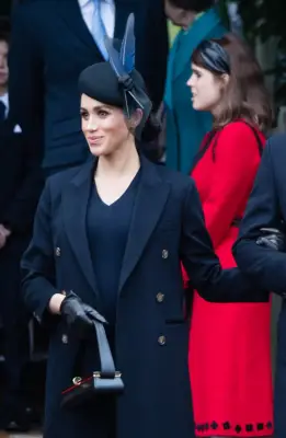 ‎Meghan Markle Carrying a Victoria Beckham Powder Box Bag in Black