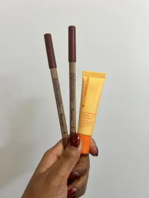 The Make Up For Ever Artist Color Pencils in Anywhere Caffeine and Wherever Walnut, and Ole Henriksen Pout Preserve Peptide Lip Treatment in Original.