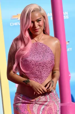 Karol G’s +57 Hand Tattoo